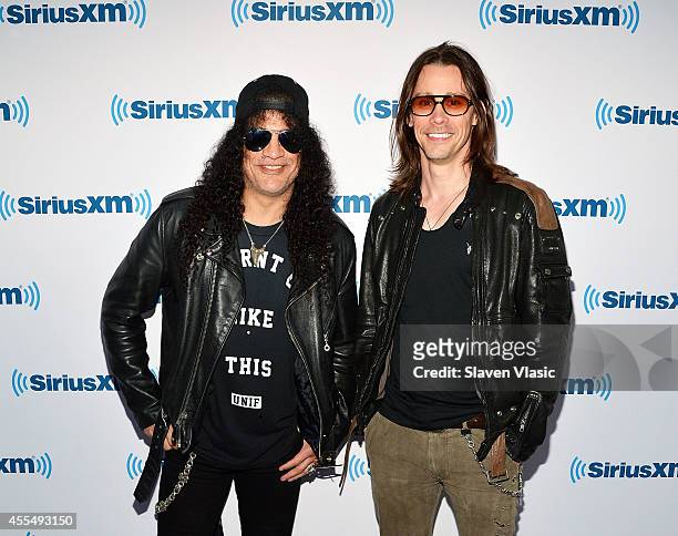 Musicians Slash and Myles Kennedy visit SiriusXM Studios on September 15, 2014 in New York City.
