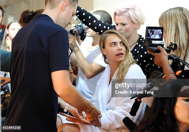 Cara Delevingne backstage at the TopShop Unique show during London Fashion Week Spring Summer 2015 at TopShop Show Space on September 14, 2014 in...