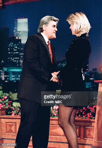 Episode 811 -- Pictured: Host Jay Leno greets model Anna-Marie Goddard as she arrives on November 23, 1995 --