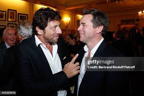 Singer Patrick Bruel and actor of the piece Guillaume de Tonquedec pose after 'Un diner d'adieu' : Premiere. Held at Theatre Edouard VII on September...