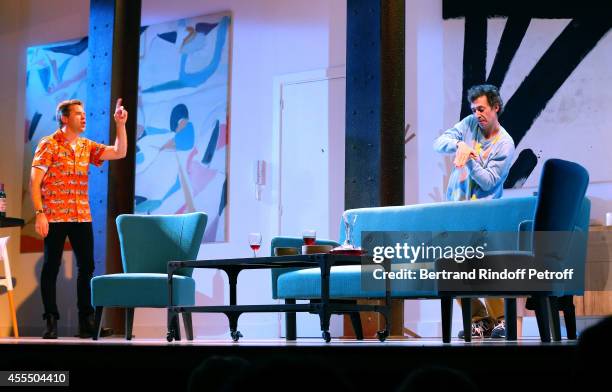 Actors Guillaume de Tonquedec and Eric Elmosnino perform in 'Un diner d'adieu' : Premiere. Held at Theatre Edouard VII on September 15, 2014 in...