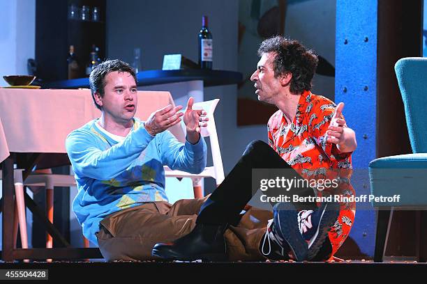 Actors Guillaume de Tonquedec and Eric Elmosnino perform in 'Un diner d'adieu' : Premiere. Held at Theatre Edouard VII on September 15, 2014 in...