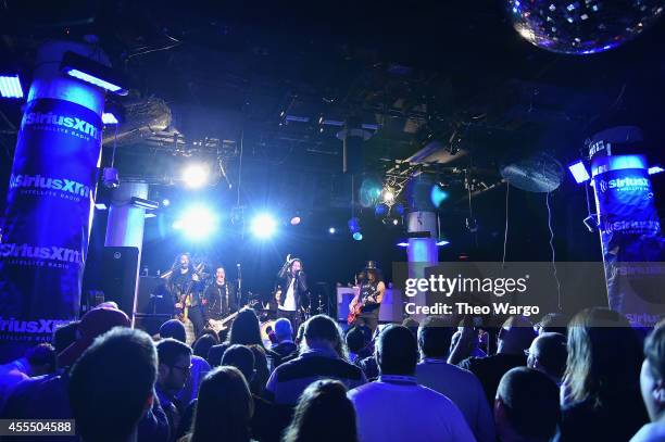 Slash and his band featuring Myles Kennedy and The Conspirators perform a private concert for SiriusXM listeners at Santos Party House in New York...
