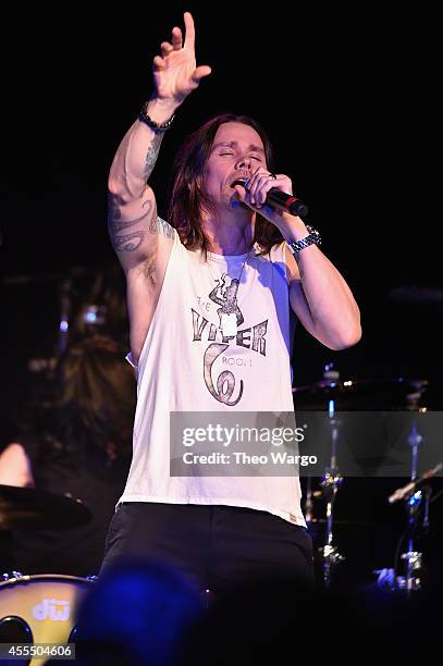 Myles Kennedy performs onstage with Slash and The Conspirators during a private concert for SiriusXM listeners at Santos Party House in New York City...