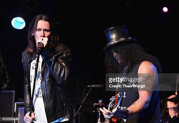 Myles Kennedy and Slash perform onstage with The Conspirators during a private concert for SiriusXM listeners at Santos Party House in New York City...