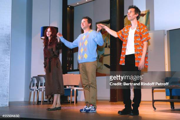 Actors Audrey Fleurot, Guillaume de Tonquedec and Eric Elmosnino acknowledge the applause of the audience at the end of 'Un diner d'adieu' :...