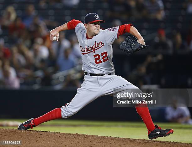 Pitcher Drew Storen of the Washington Nationals throws a pitch in the ninth inning during the game against the Atlanta Braves at Turner Field on...