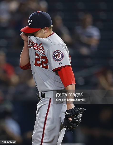 Pitcher Drew Storen of the Washington Nationals reacts after a close call on a pitch in the ninth inning during the game against the Atlanta Braves...