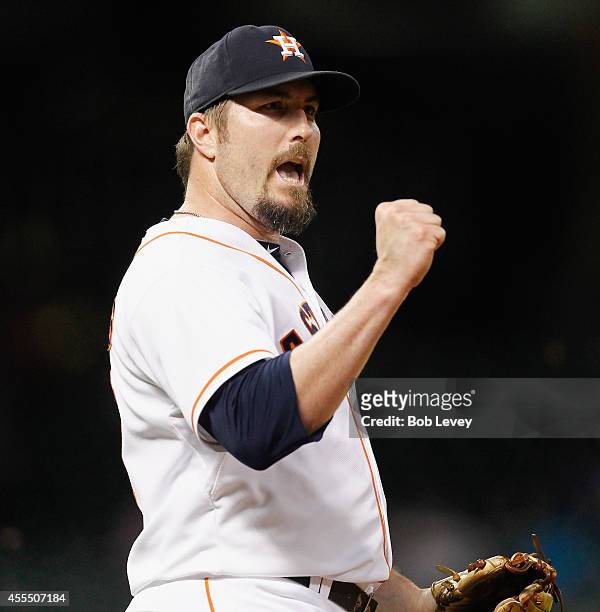 Chad Qualls of the Houston Astros pumps his fist after the final out as the Houston Astros defeat the Cleveland Indians 3-1 at Minute Maid Park on...