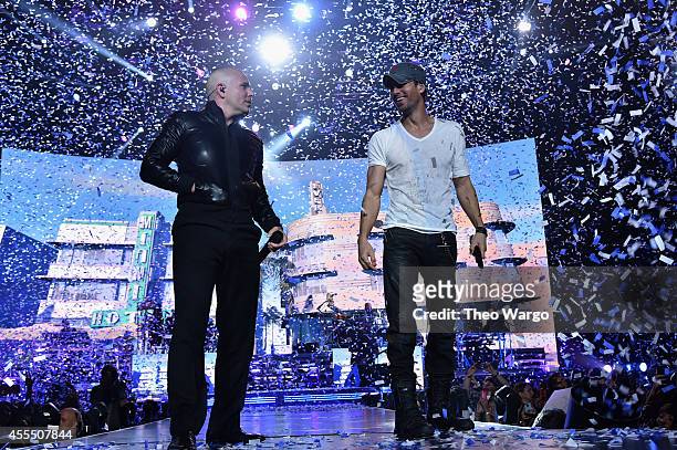 Enrique Iglesias and Pitbull with special guest J Balvin perform at opening night of U.S. Tour at Prudential Center on September 12, 2014 in Newark,...