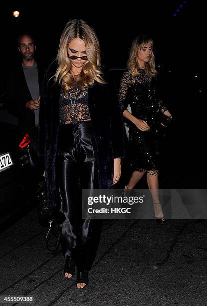 Cara Delevingne and Suki Waterhouse arrive at Downing Street for Samantha Cameron's reception to celebrate London Fashion Week on September 15, 2014...