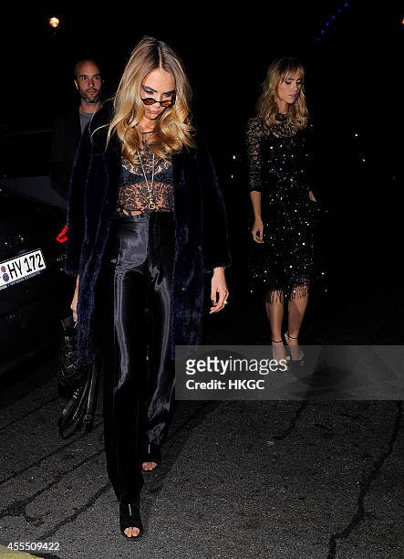 Cara Delevingne and Suki Waterhouse arrive at Downing Street for Samantha Cameron's reception to celebrate London Fashion Week on September 15, 2014...