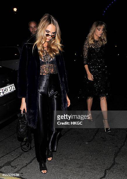 Cara Delevingne and Suki Waterhouse arrive at Downing Street for Samantha Cameron's reception to celebrate London Fashion Week on September 15, 2014...