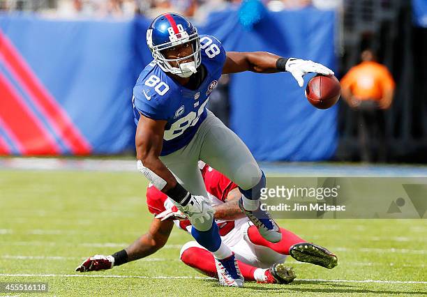 Victor Cruz of the New York Giants reacts after a reception against the Arizona Cardinals on September 14, 2014 at MetLife Stadium in East...