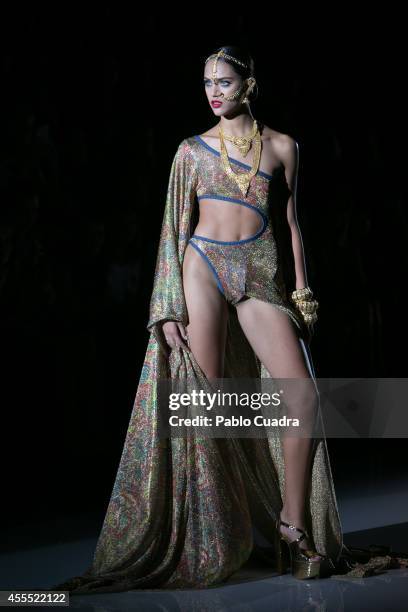 Model showcases designs by Andres Sarda on the runway during the Mercedes-Benz Fashion Week Madrid Spring/Summer 2015 at Ifema on September 15, 2014...