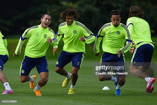 Eden Hazard, Nathan Ake and Lewis Baker of Chelsea in action during a Chelsea training session at the Chelsea training ground on September 16, 2014...