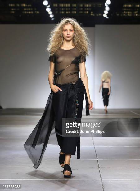 Model walks the runway at the Marques'Almeida show during London Fashion Week Spring Summer 2015 on September 16, 2014 in London, England.