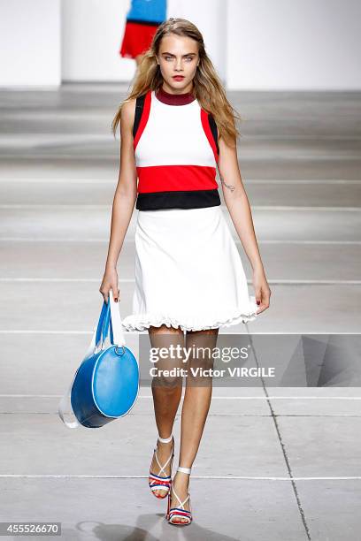 Cara Delevingne walks the runway at the TopShop Unique show during London Fashion Week Spring Summer 2015 on September 14, 2014 in London, England.