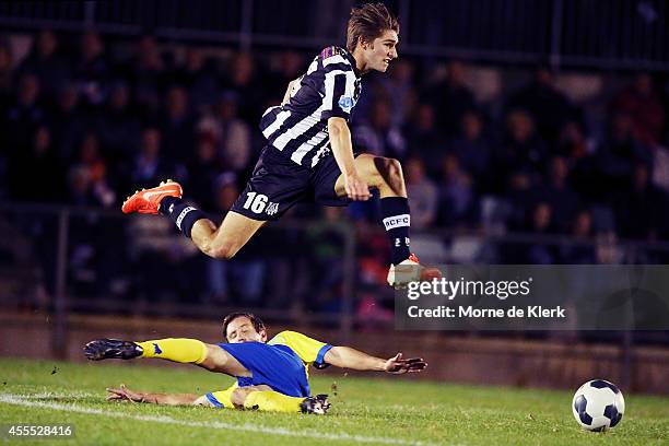 Thomas Love of Adelaide evades a tackle to win the ball during the FFA Cup match between Adelaide City and the Brisbane Strikers at the on September...