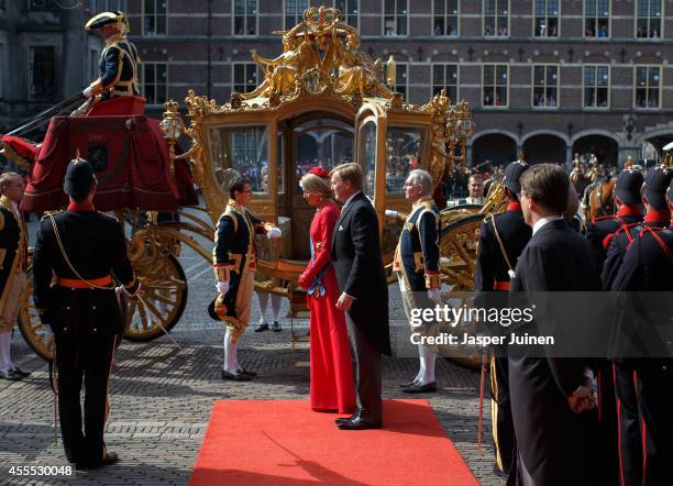 King Willem-Alexander of the Netherlands arrives with Queen Maxima in the golden carriage at the seat of the Dutch government on September 16, 2014...