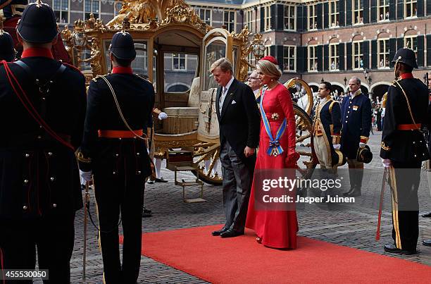 King Willem-Alexander of the Netherlands arrives with Queen Maxima in the golden carriage at the seat of the Dutch government on September 16, 2014...