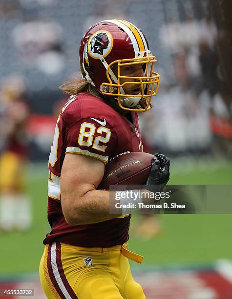 Washington Redskins tight end Logan Paulsen warms up against the Houston Texans on September 7, 2014 at NRG Stadium in Houston, Texas.