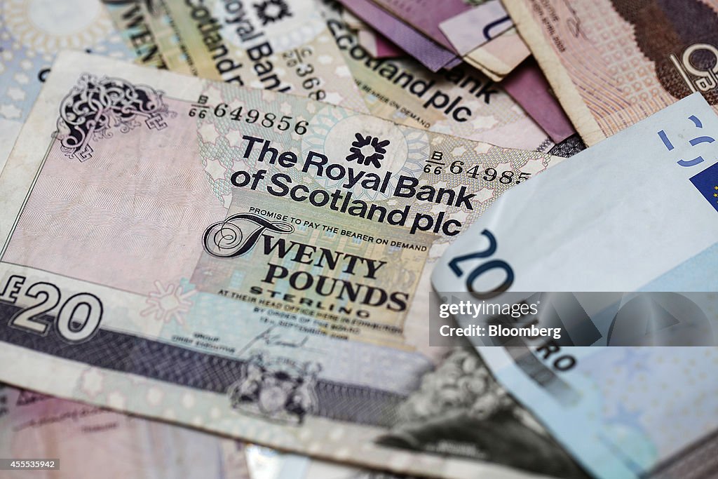 Scottish Sterling Pound Notes And Coins At A Travelex Holdings Ltd. Currency Exchange Store