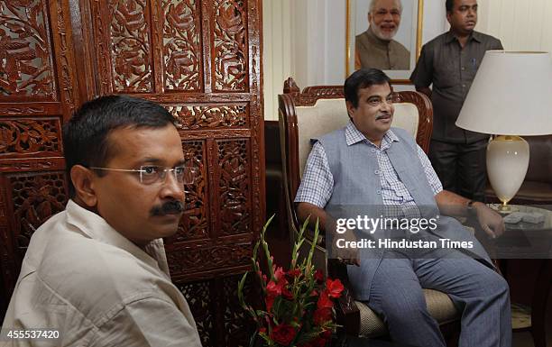 Aam Aadmi Party convener Arvind Kejriwal with Union Minister for Road Transport and Highways Nitin Gadkari during a meeting on regularizing...