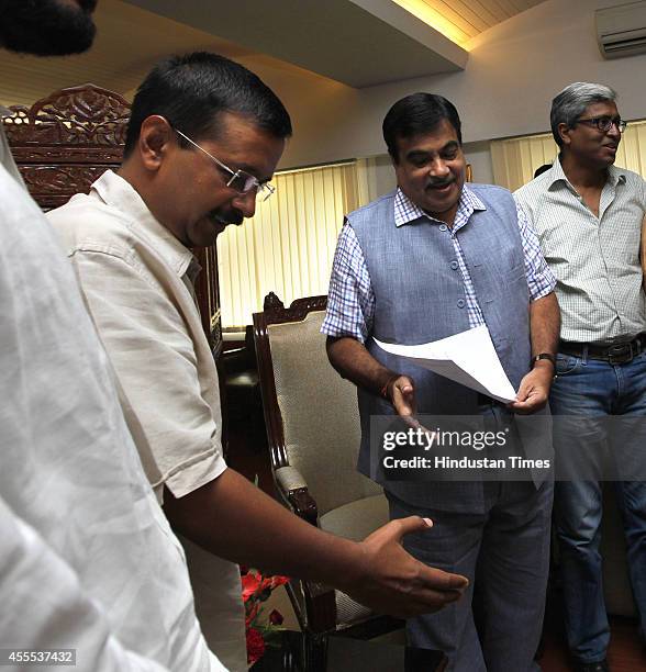 Aam Aadmi Party convener Arvind Kejriwal with Union Minister for Road Transport and Highways Nitin Gadkari during a meeting on regularizing...