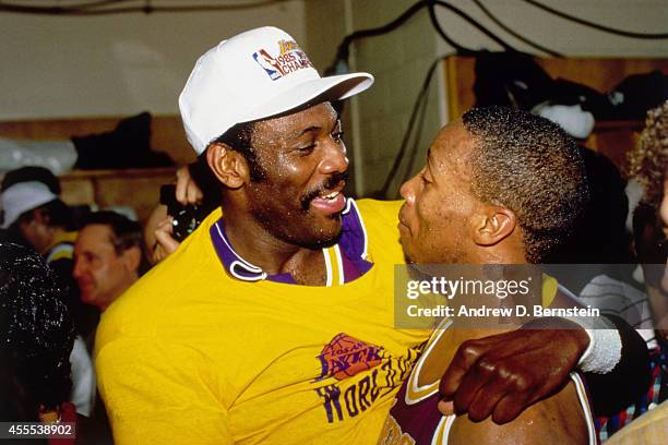 Bob McAdoo and Byron Scott of the Los Angeles Lakers celebrate after winning Game Six of the 1985 NBA Finals against the Boston Celtics on June 9,...