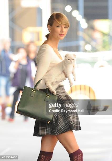 Singer Taylor Swift and Cat are seen in Soho on September 16, 2014 in New York City.