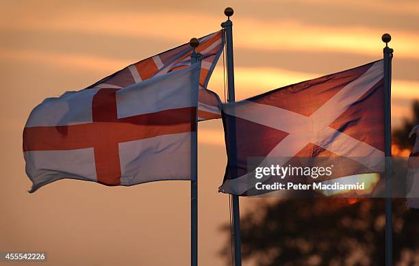 The sun sets behind the Union flag , the flag of England and the Scottish Saltire on September 16, 2014 in Gretna Green, Scotland. Yes and No...