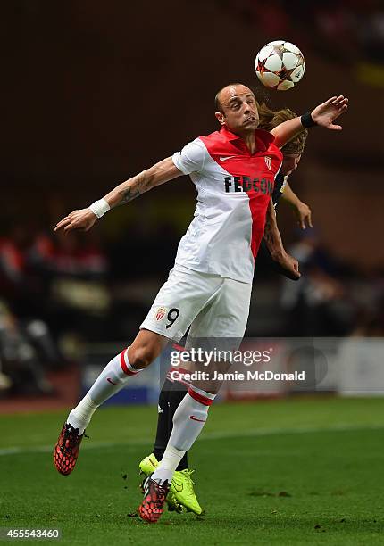 Tin Jedvaj of Bayer Leverkusen and Dimitar Berbatov of Monaco compete for the header during the UEFA Champions League Group C match between AS Monaco...