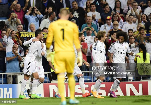 Real Madrid player celebrate after scoring their first team goal during the UEFA Champions League football match Real Madrid CF vs FC Basel 1893 at...