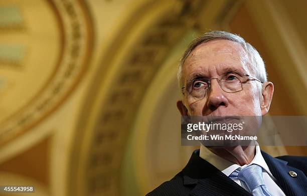 Senate Majority Leader Harry Reid answers questions following the weekly Democratic policy luncheon at the U.S. Capitol September 16, 2014 in...