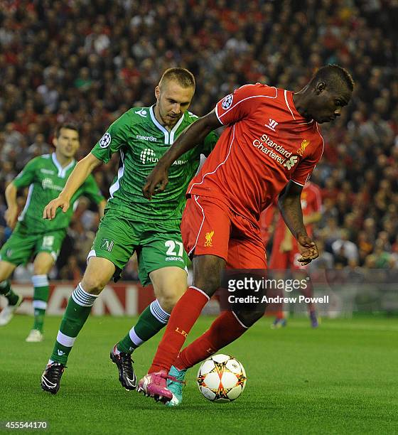 Mario Balotelli of Liverpool and Cosmin Moti of PFC Ludogorets compete during the UEFA Champions League match between Liverpool and PFC Ludogorets...