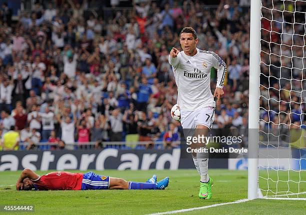 Cristiano Ronaldo of Real Madrid celebrates after scoring Real's 3rd goal during the UEFA Champions League Group B match between Real Madrid CF and...