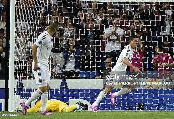 Real Madrid's Colombian midfielder James Rodriguez celebrates after scoring during the UEFA Champions League football match Real Madrid CF vs FC...