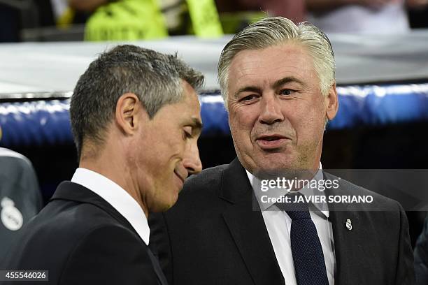 Real Madrid's Italian coach Carlo Ancelotti greets Basel's Portuguese coach Paulo Sousa moments before the UEFA Champions League football match Real...