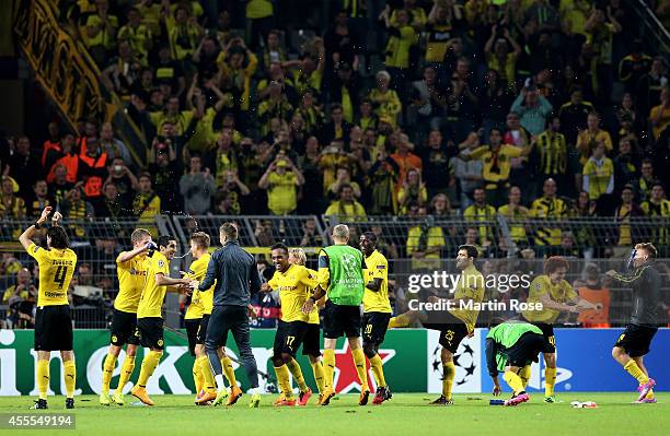 The Dortmund players celebrate their 2-0 victory during the UEFA Champions League Group D match between Borussia Dortmund and Arsenal at Signal Iduna...