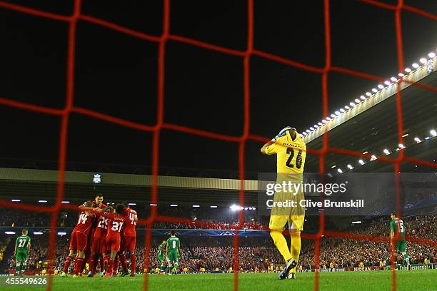 Steven Gerrard of Liverpool celebrates scoring the second goal from the penalty spot with team mates as Milan Borjan of PFC Ludogorets Razgrad reacts...