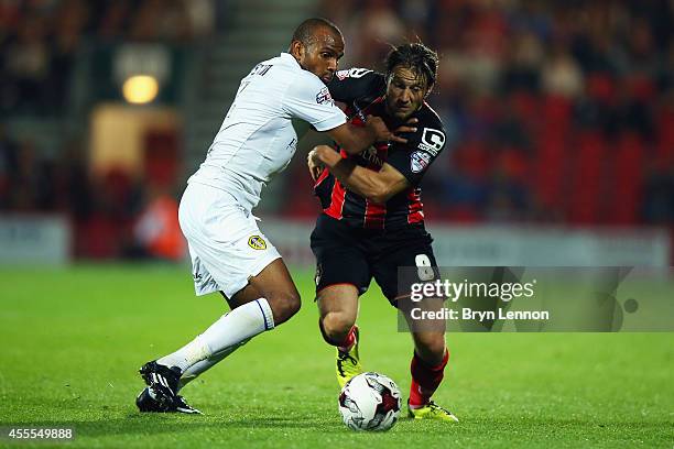 Rodolph Austin of Leeds United battles with Harry Arter of AFC Bournemouth battles with Stephen Warnock of Leeds United during the Sky Bet...