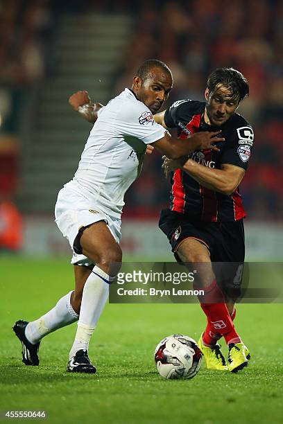 Rodolph Austin of Leeds United battles with Harry Arter of AFC Bournemouth battles with Stephen Warnock of Leeds United during the Sky Bet...