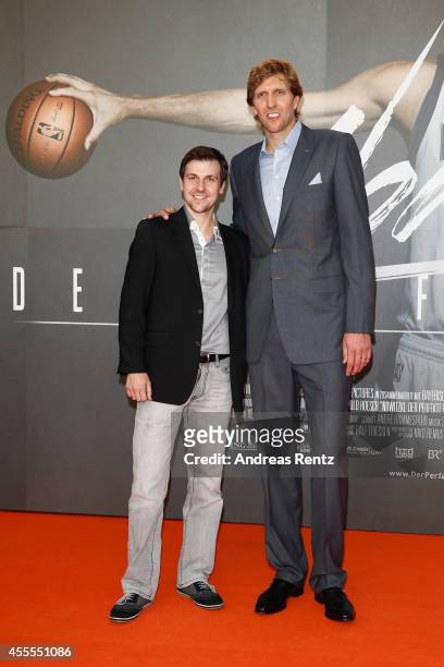 Timo Boll and Dirk Nowitzki attend the premiere of the film 'Nowitzki. Der Perfekte Wurf' at Cinedom on September 16, 2014 in Cologne, Germany.