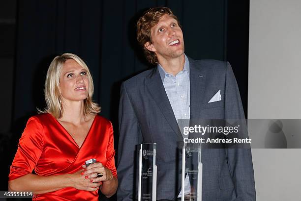 Dirk Nowitzki and his sister Silke Nowitzki attend the premiere of the film 'Nowitzki. Der Perfekte Wurf' at Cinedom on September 16, 2014 in...