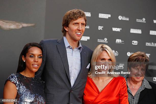 Wife Jessica Nowitzki with Dirk Nowitzki, sister Silke Nowitzki and mother Helga Nowitzki attend the premiere of the film 'Nowitzki. Der Perfekte...