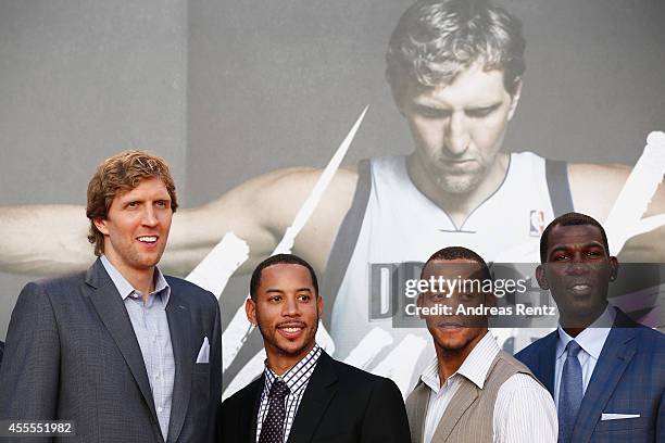 Players Dirk Nowitzki, Devin Harris, Monta Ellis and Michael Finley attend the premiere of the film 'Nowitzki. Der Perfekte Wurf' at Cinedom on...