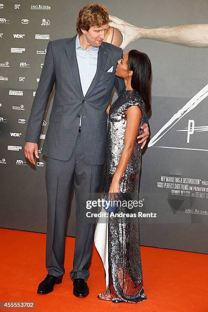 Dirk Nowitzki and his wife Jessica Nowitzki attend the premiere of the film 'Nowitzki. Der Perfekte Wurf' at Cinedom on September 16, 2014 in...