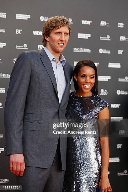 Dirk Nowitzki and his wife Jessica Nowitzki attend the premiere of the film 'Nowitzki. Der Perfekte Wurf' at Cinedom on September 16, 2014 in...