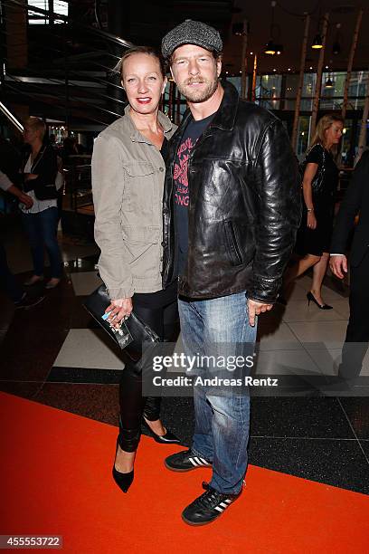 Henning Baum and his wife Corinna Baum attend the premiere of the film 'Nowitzki. Der Perfekte Wurf' at Cinedom on September 16, 2014 in Cologne,...